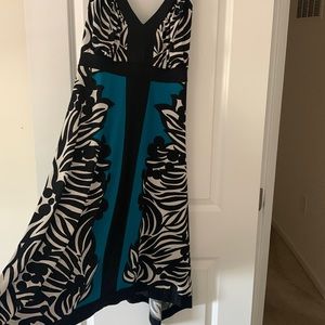 Like new dress knee length with longer sides. Black, white and blue.